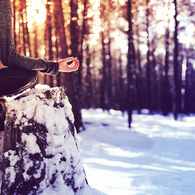 Hands in mudra in snowy setting